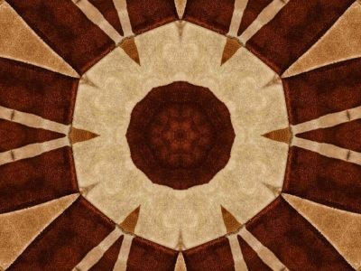 Brown and beige carpet with kaleidoscope-style geometric pattern.